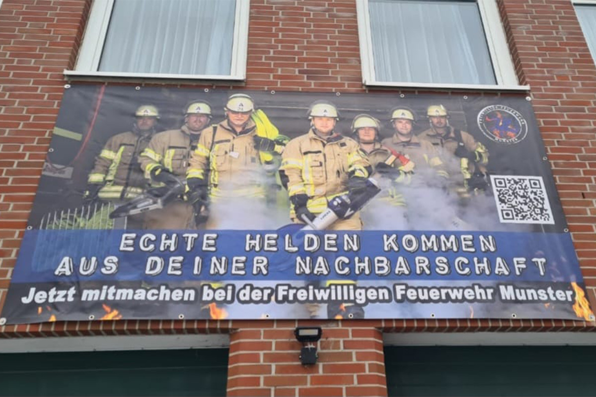 Plakat mit der Freiwilligen Feuerwehr Munster
